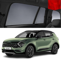 A green KIA Sportage car with snap on window sun shades installed on the rear passenger window.